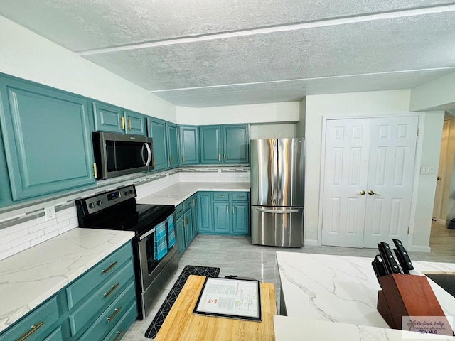 kitchen featuring decorative backsplash, stainless steel appliances, and light stone counters