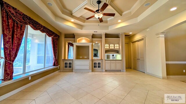 5805 Acacia, Harlingen, TX 78552 - unfurnished living room with light tile patterned floors, baseboards, arched walkways, ceiling fan, and crown molding