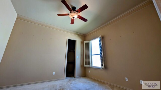 5805 Acacia, Harlingen, TX 78552 - unfurnished bedroom with baseboards, ceiling fan, a closet, crown molding, and carpet flooring