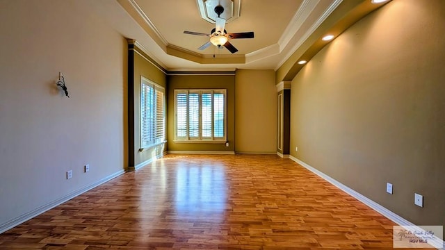5805 Acacia, Harlingen, TX 78552 - spare room featuring baseboards, ceiling fan, ornamental molding, wood finished floors, and a raised ceiling
