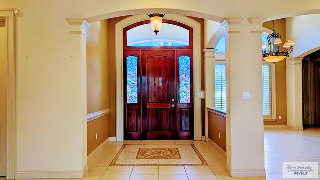 5805 Acacia, Harlingen, TX 78552 - entryway with ornate columns, baseboards, and tile patterned flooring