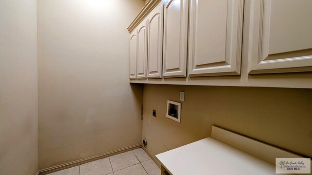 5805 Acacia, Harlingen, TX 78552 - clothes washing area featuring cabinet space, hookup for an electric dryer, hookup for a washing machine, and light tile patterned flooring