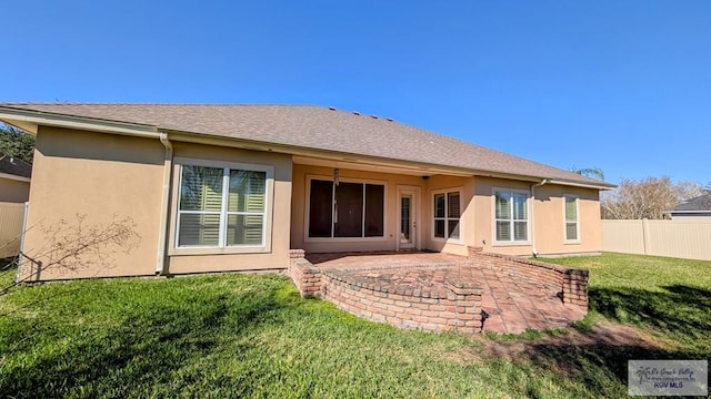5805 Acacia, Harlingen, TX 78552 - rear view of house with stucco siding, a lawn, a patio area, and fence