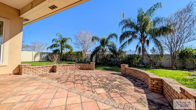5805 Acacia, Harlingen, TX 78552 - view of patio / terrace featuring visible vents and a fenced backyard