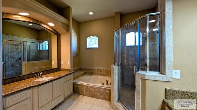 5805 Acacia, Harlingen, TX 78552 - bathroom with a garden tub, a stall shower, vanity, and tile patterned flooring