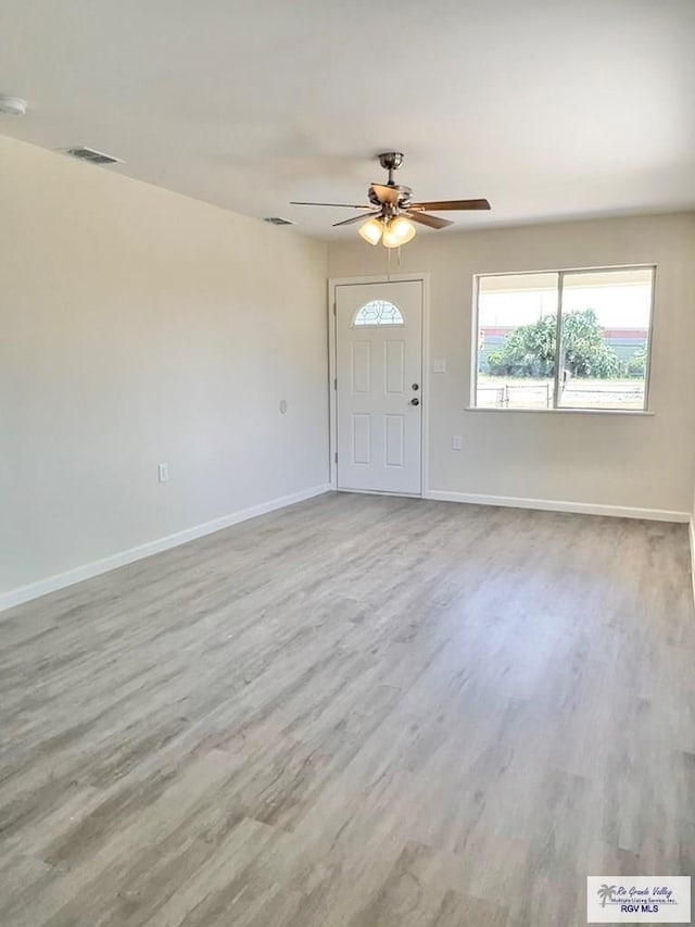 foyer featuring ceiling fan and light wood-type flooring