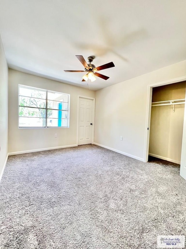 unfurnished bedroom featuring ceiling fan, carpet floors, and a closet