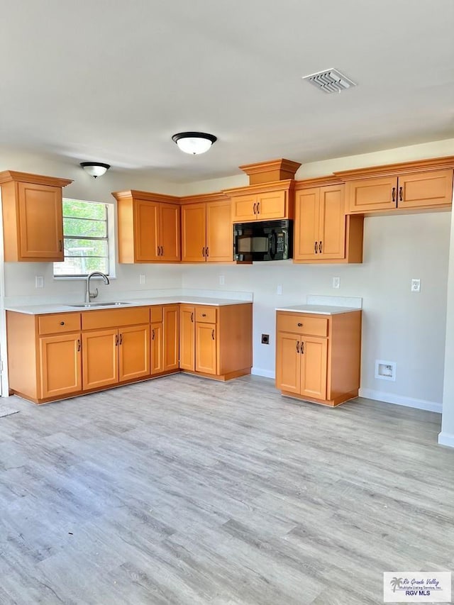 kitchen featuring light hardwood / wood-style floors and sink