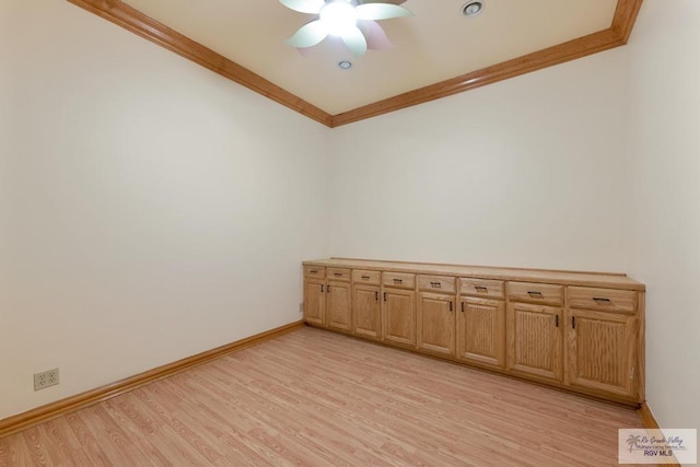 empty room featuring ceiling fan, light hardwood / wood-style floors, and ornamental molding