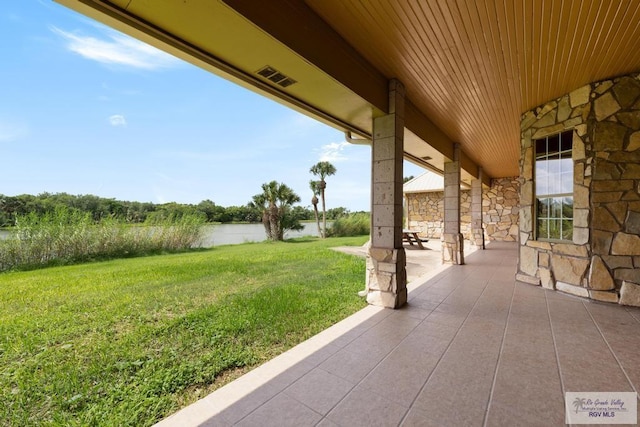 view of patio / terrace featuring a water view