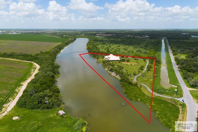 aerial view with a rural view and a water view