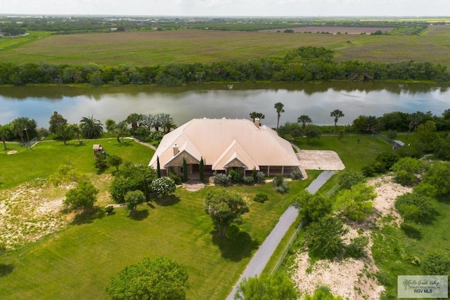 drone / aerial view featuring a rural view and a water view