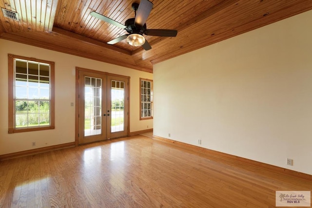 empty room featuring french doors, light hardwood / wood-style floors, plenty of natural light, and wooden ceiling