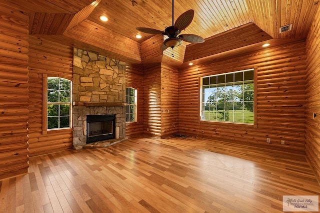 unfurnished living room with rustic walls, wooden ceiling, and hardwood / wood-style flooring