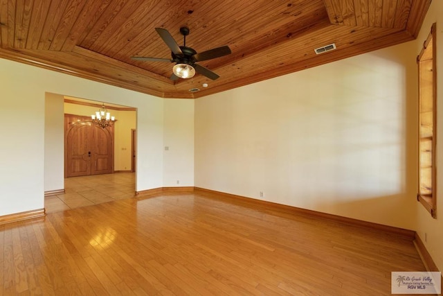 empty room featuring ceiling fan with notable chandelier, light hardwood / wood-style flooring, wooden ceiling, and crown molding