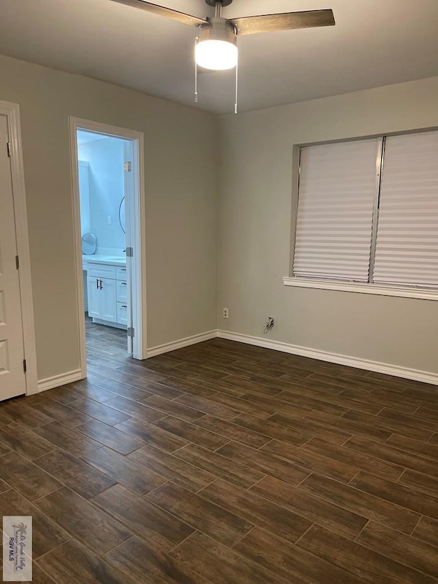 917 S Houston Dr, Harlingen, TX 78550 - spare room with baseboards, a ceiling fan, and wood tiled floor