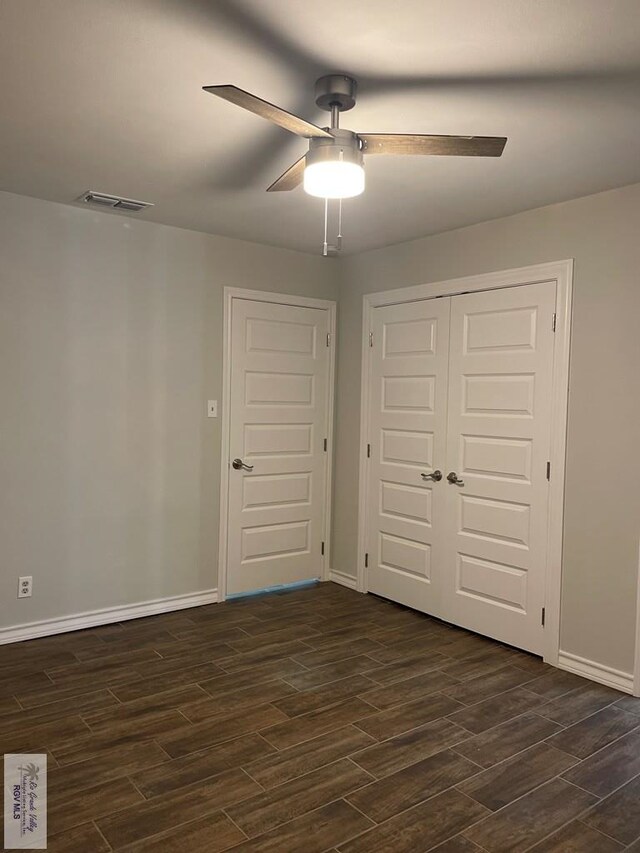 917 S Houston Dr, Harlingen, TX 78550 - unfurnished bedroom featuring a closet, ceiling fan, baseboards, and wood tiled floor