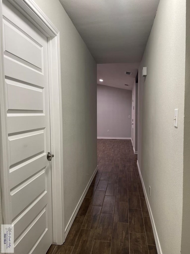 917 S Houston Dr, Harlingen, TX 78550 - corridor featuring visible vents, baseboards, and wood finish floors