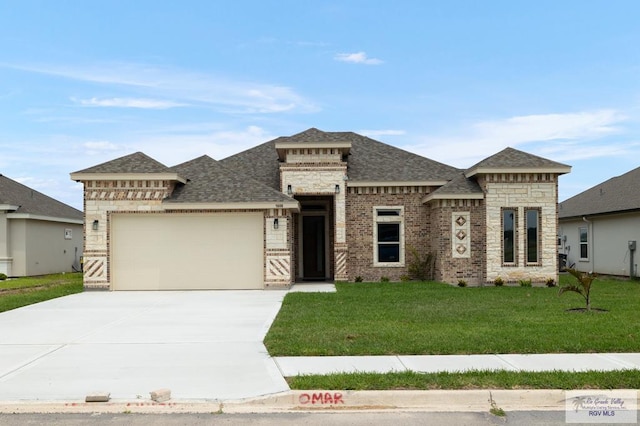 1606 Arden St, Mercedes, TX 78570 - view of front facade featuring an attached garage, a shingled roof, a front lawn, driveway, and brick siding
