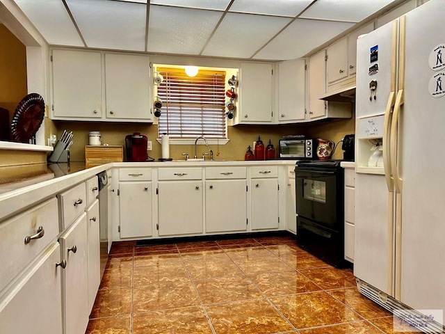 kitchen featuring sink, tile patterned flooring, white refrigerator with ice dispenser, black / electric stove, and white cabinets