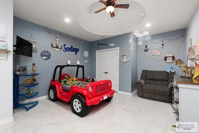 bedroom featuring ceiling fan and a closet