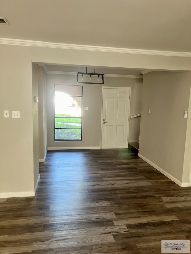 interior space with ornamental molding and dark wood-type flooring