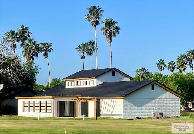 back of house with a yard