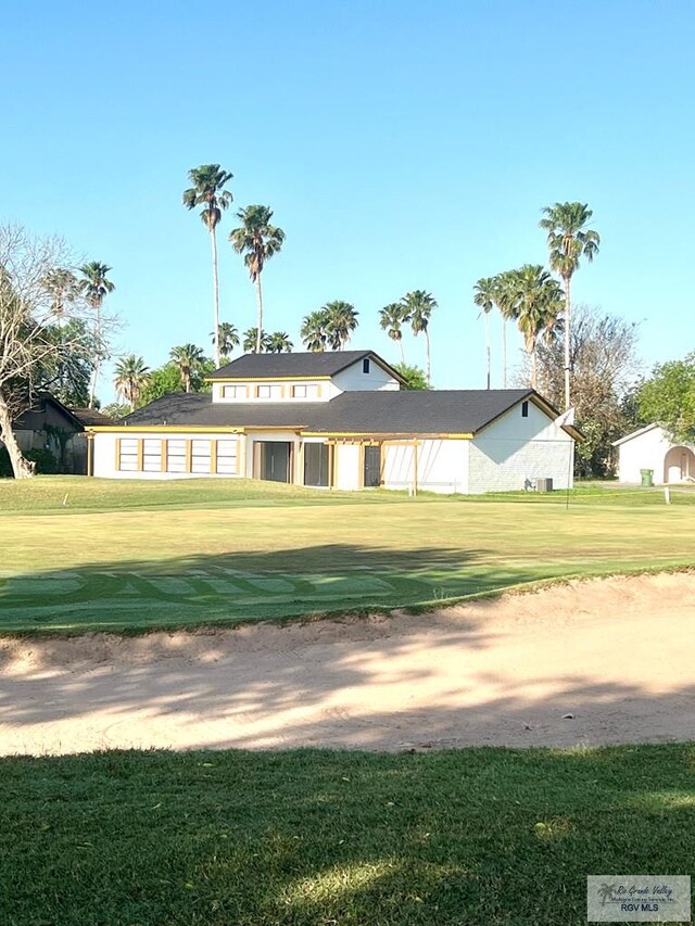 view of property's community with a lawn