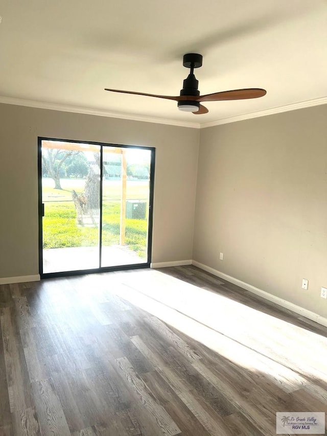 empty room featuring ceiling fan, dark hardwood / wood-style flooring, and ornamental molding