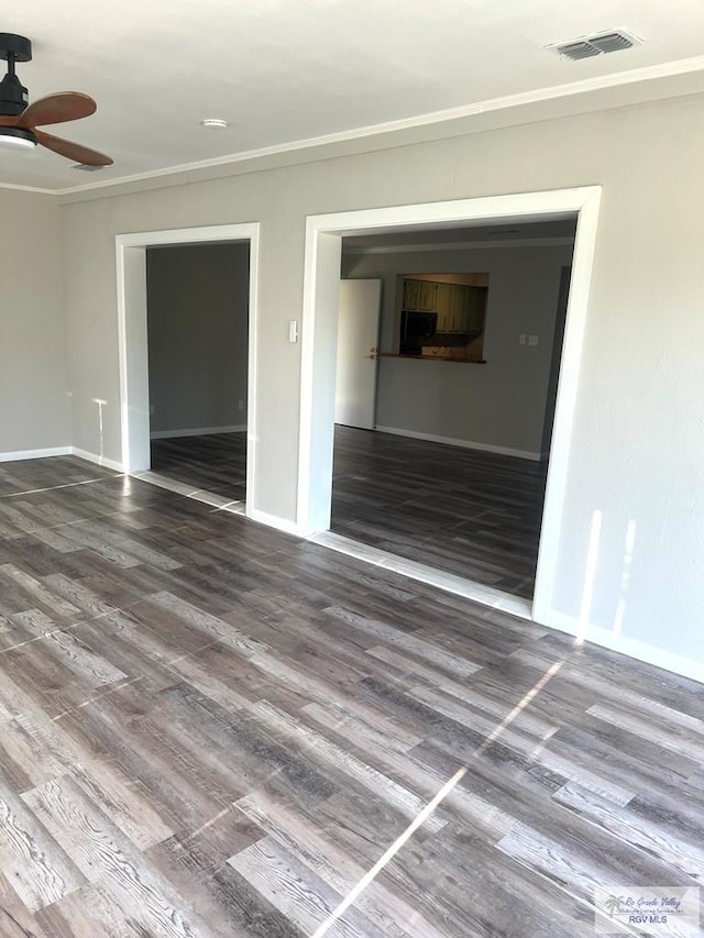 empty room with hardwood / wood-style floors, ceiling fan, and ornamental molding