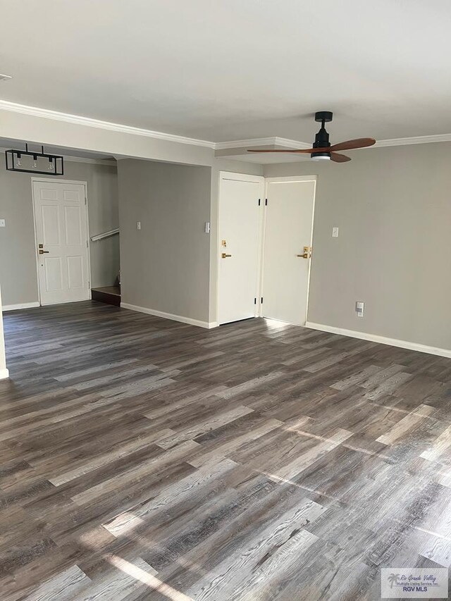 unfurnished room featuring dark hardwood / wood-style floors, ceiling fan, and crown molding