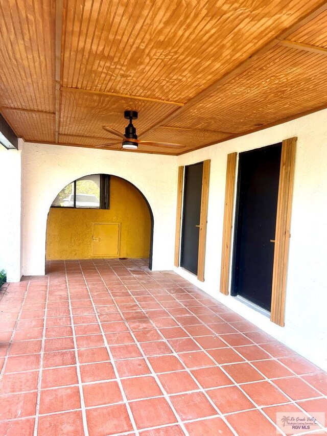 view of patio featuring ceiling fan