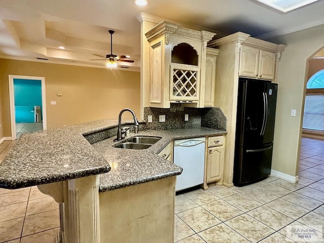 kitchen with white dishwasher, ceiling fan, black fridge, and kitchen peninsula