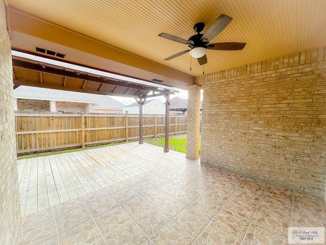 view of patio featuring ceiling fan and a wooden deck