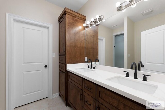 bathroom featuring tile patterned floors and vanity