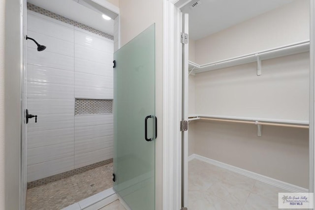 bathroom featuring an enclosed shower