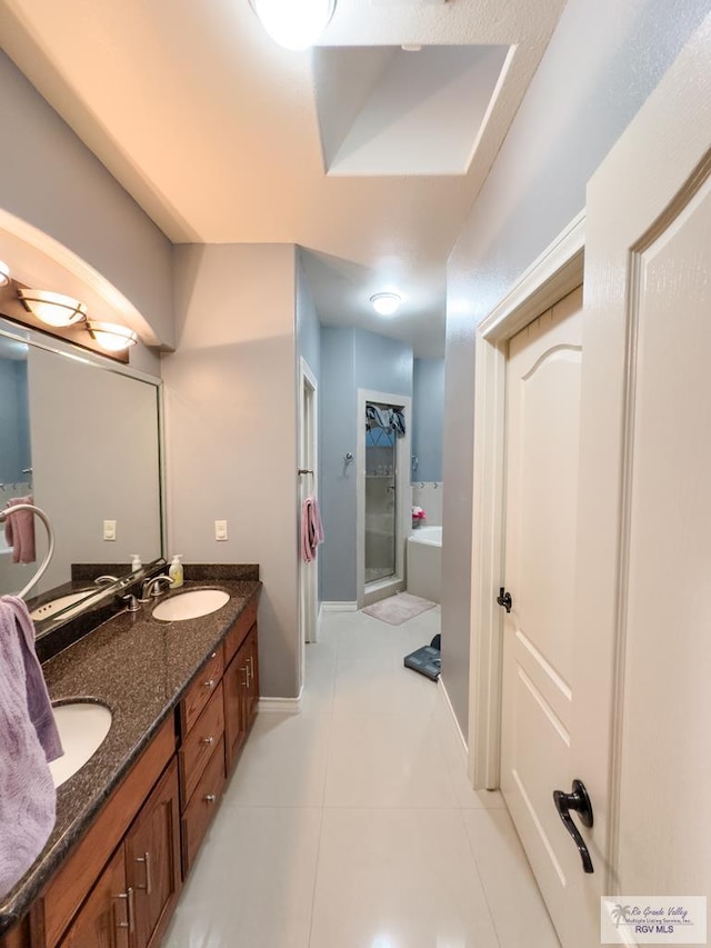 bathroom with plus walk in shower, tile patterned flooring, and vanity