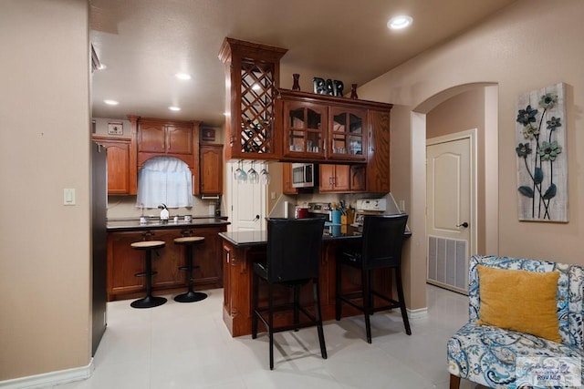 kitchen with a kitchen island and a breakfast bar area