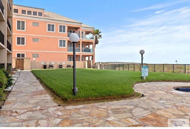 4300 Gulf Blvd Unit 105, South Padre Island, TX 78597 - surrounding community featuring a lawn
