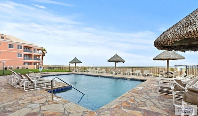 view of pool featuring a patio