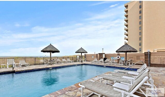 4300 Gulf Blvd Unit 105, South Padre Island, TX 78597 - view of pool with a patio area