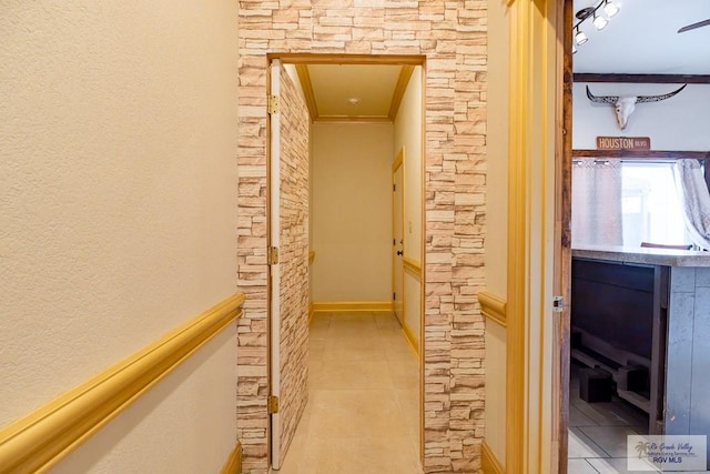 hall with light tile patterned floors