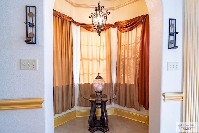 hallway with arched walkways, a notable chandelier, and tile patterned floors