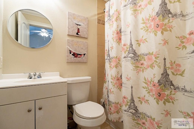 bathroom with toilet, curtained shower, and vanity