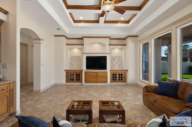 5713 Spicewood, Harlingen, TX 78552 - living area with ceiling fan, arched walkways, crown molding, coffered ceiling, and baseboards