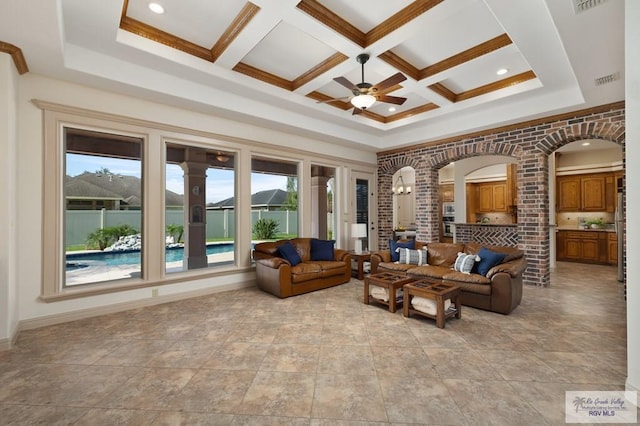 5713 Spicewood, Harlingen, TX 78552 - living room with a ceiling fan, healthy amount of natural light, coffered ceiling, arched walkways, and beam ceiling