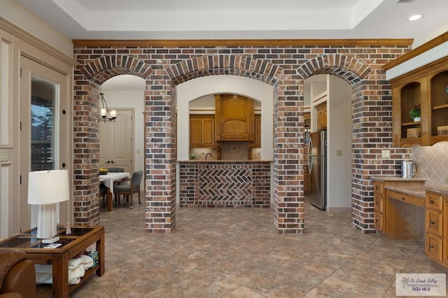 5713 Spicewood, Harlingen, TX 78552 - living area featuring a tray ceiling and a chandelier