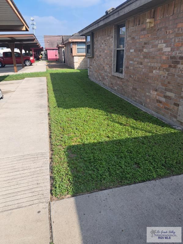 view of yard with a carport