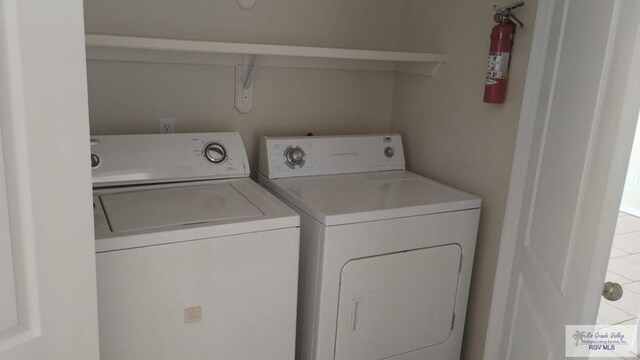 laundry room featuring washer and clothes dryer