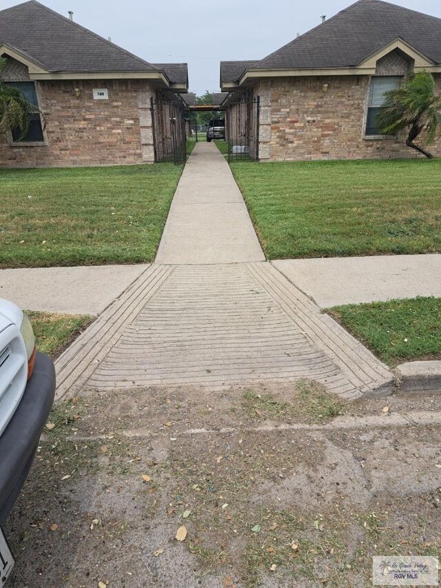 view of side of property featuring a lawn